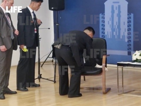 Kim Jong Un's security rush to wipe down his chair during talks with Putin